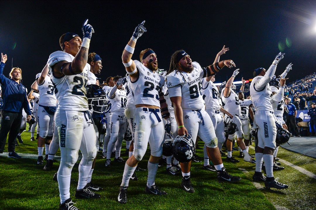 Leah Hogsten  |  The Salt Lake Tribune   Utah State Aggies celebrate the win after defeating BYU, 45-20, at Lavell Edwards Stadium in Provo, Friday, Oct. 5, 2018.