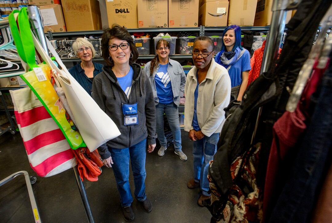 (Steve Griffin  |  The Salt Lake Tribune)  Volunteers Peggy Montrone, Kathy Wagner, De Buchanan, Erma Decaria and Natalie Bagnell in the donation room at Volunteers of America, in Salt Lake in Salt Lake City Monday December 11, 2017. The group volunteers their time to organize donated items intended for homeless young people.