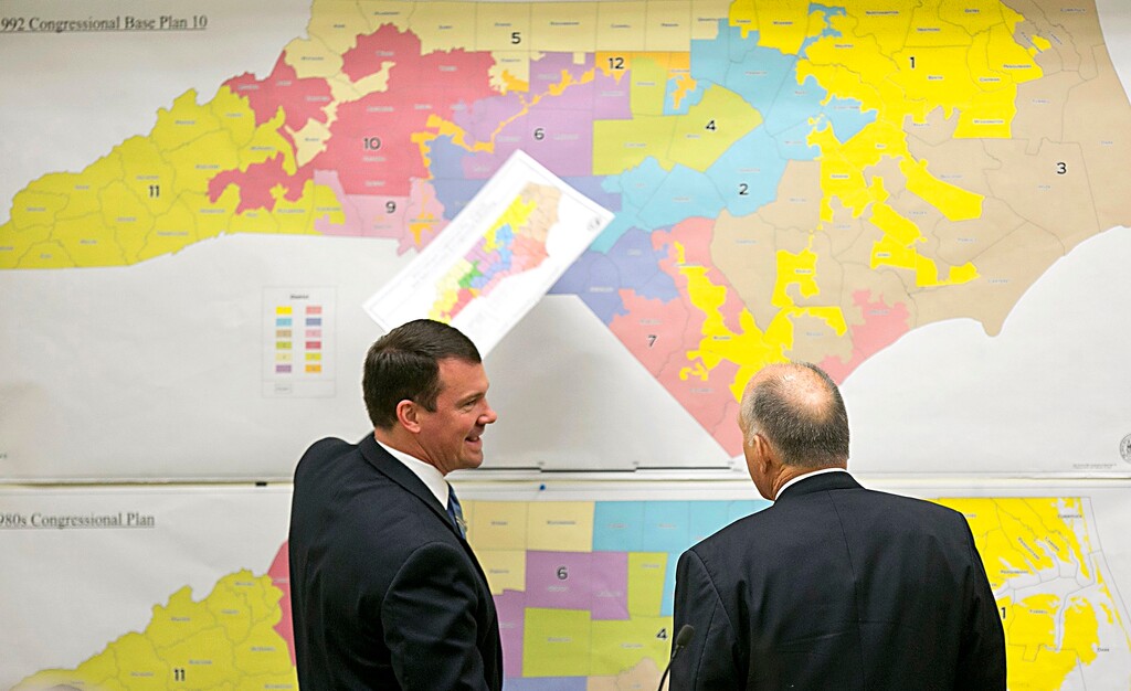 (Corey Lowenstein | The News & Observer | The Associated Press) In this Feb. 16, 2016, file photo, Republican state Sens. Dan Soucek, left, and Brent Jackson review historical maps during the Senate Redistricting Committee for the 2016 Extra Session in the Legislative Office Building at the N.C. General Assembly in Raleigh, N.C. A growing number of states are considering changing the criteria or methods used to draw congressional and state legislative districts. The proposals being advanced this year are part of a larger battle between Republicans and Democrats to position themselves for the 2020 Census, when districts will be redrawn.