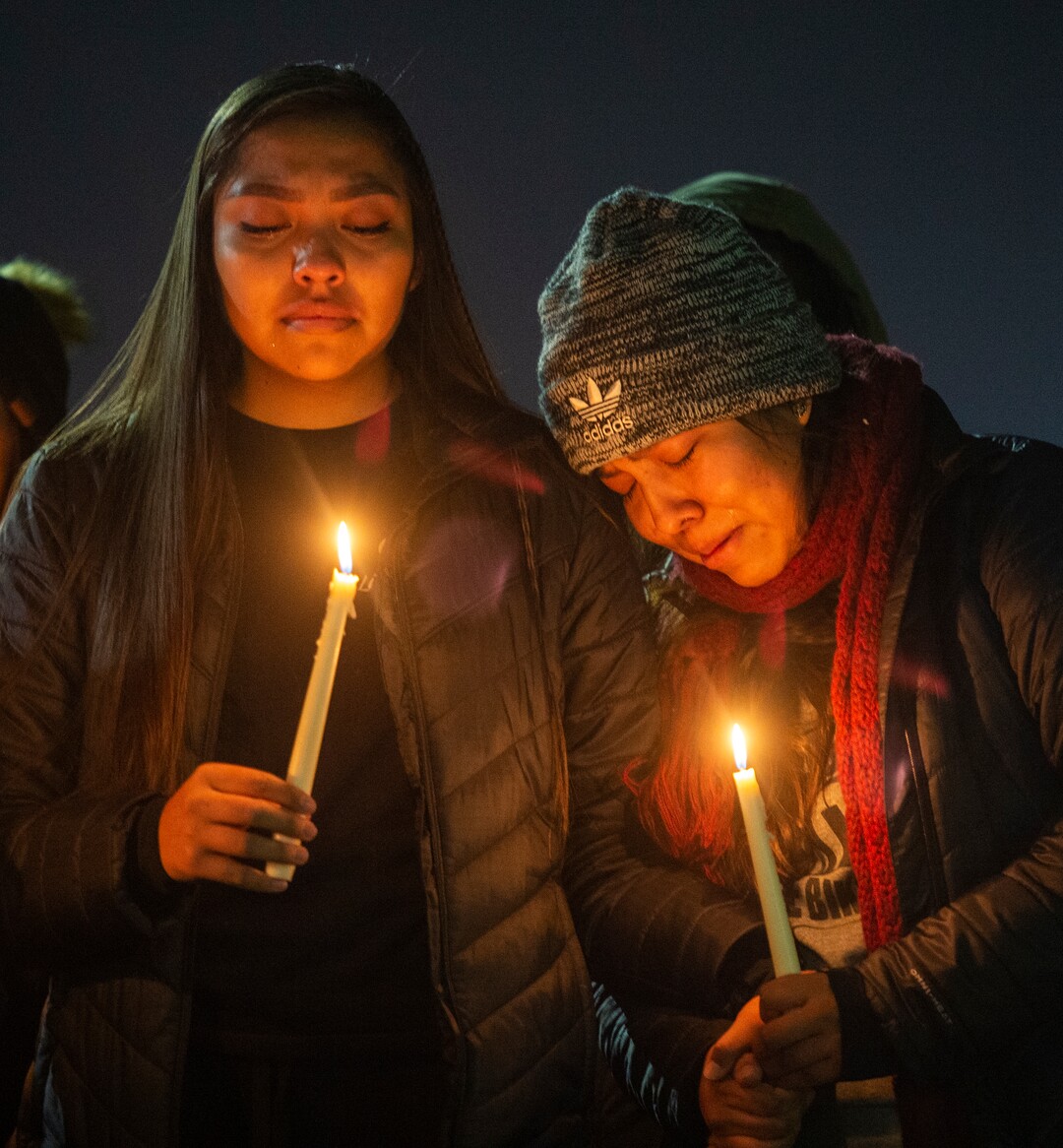(Rick Egan  |  The Salt Lake Tribune)      Dion and Erin Tapahe hold hands as they listen to a song during a candlelight vigil on BYU campus, for the student who died by suicide this week, at the Tanner Building, Friday, Dec. 7, 2018.  