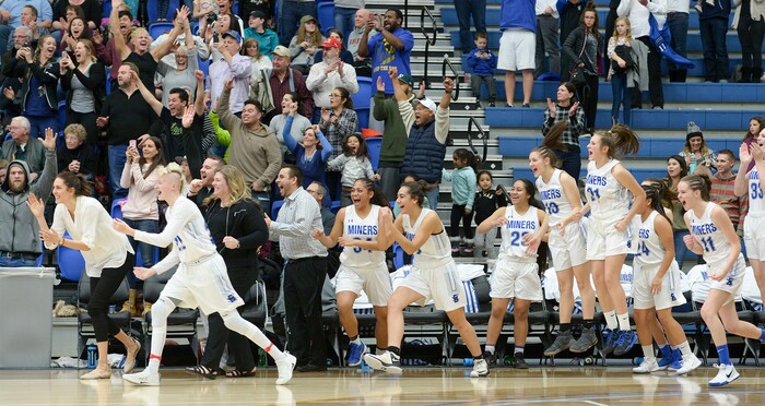 (Leah Hogsten  |  The Salt Lake Tribune) Bingham's head coach Charron Mason and the team celebrate the win.  Bingham defeated Copper Hills 48-40 in their semifinal game of the 6A High School Girls' Basketball Tournament at SLCC in Taylorsville, Friday, Feb. 23, 2018. 