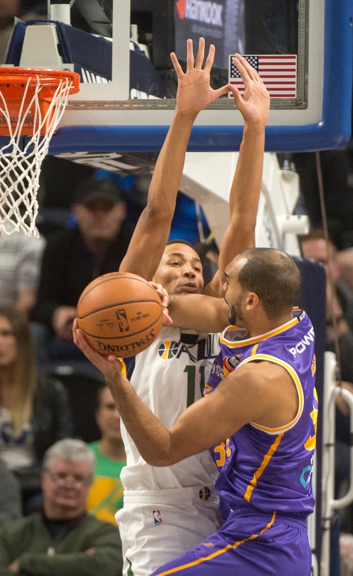 (Rick Egan  |  The Salt Lake Tribune) Sydney Kings guard Perry Ellis (34) goes to the hoopUtah Jazz guard Dante Exum (11) defends,  in preseason basketball Utah Jazz vs.Sydney Kings, in Salt Lake City, Sunday, October 2, 2017.


