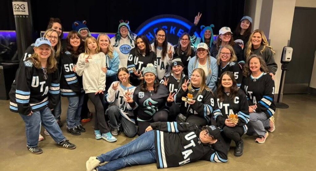 (Kristin Anderson) Members of doanher nation join for a photo in front of Portal X at Delta Center during the Utah Mammoth’s inaugural season.