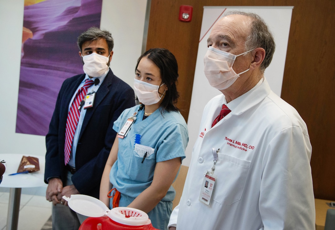 (Francisco Kjolseth  | The Salt Lake Tribune) Tom Miller, MD, Chief Medical Officer, U of U Health, right, discusses how the University of Utah Health has begun administering the second dose of the Pfizer-BioNTech COVID-19 during a press event on Thursday, Jan. 7, 2021, in which Christy Mulder, RN, MICU received her second dose. At left is Kavish Choudhary, PharmD, Senior Director, U of U Health Pharmacy.