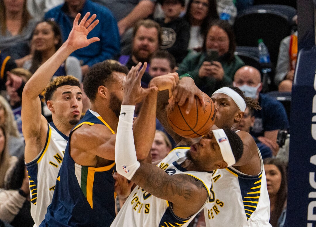 (Rick Egan | The Salt Lake Tribune) Utah Jazz center Rudy Gobert (27) goes for the ball along with Indiana Pacers forward Torrey Craig (13), in NBA action between the Utah Jazz and the Indiana Pacers at Vivint Arena, on Thursday, Nov. 11, 2021.