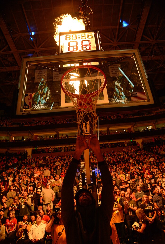 (Francisco Kjolseth  |  The Salt Lake Tribune)  Utah Jazz forward Thabo Sefolosha (22) hangs off the net as the Utah Jazz are introduced prior to their game against the Sacramento Kings in their NBA game at Vivint Smart Home Arena Friday, April 5, 2019, in Salt Lake City.