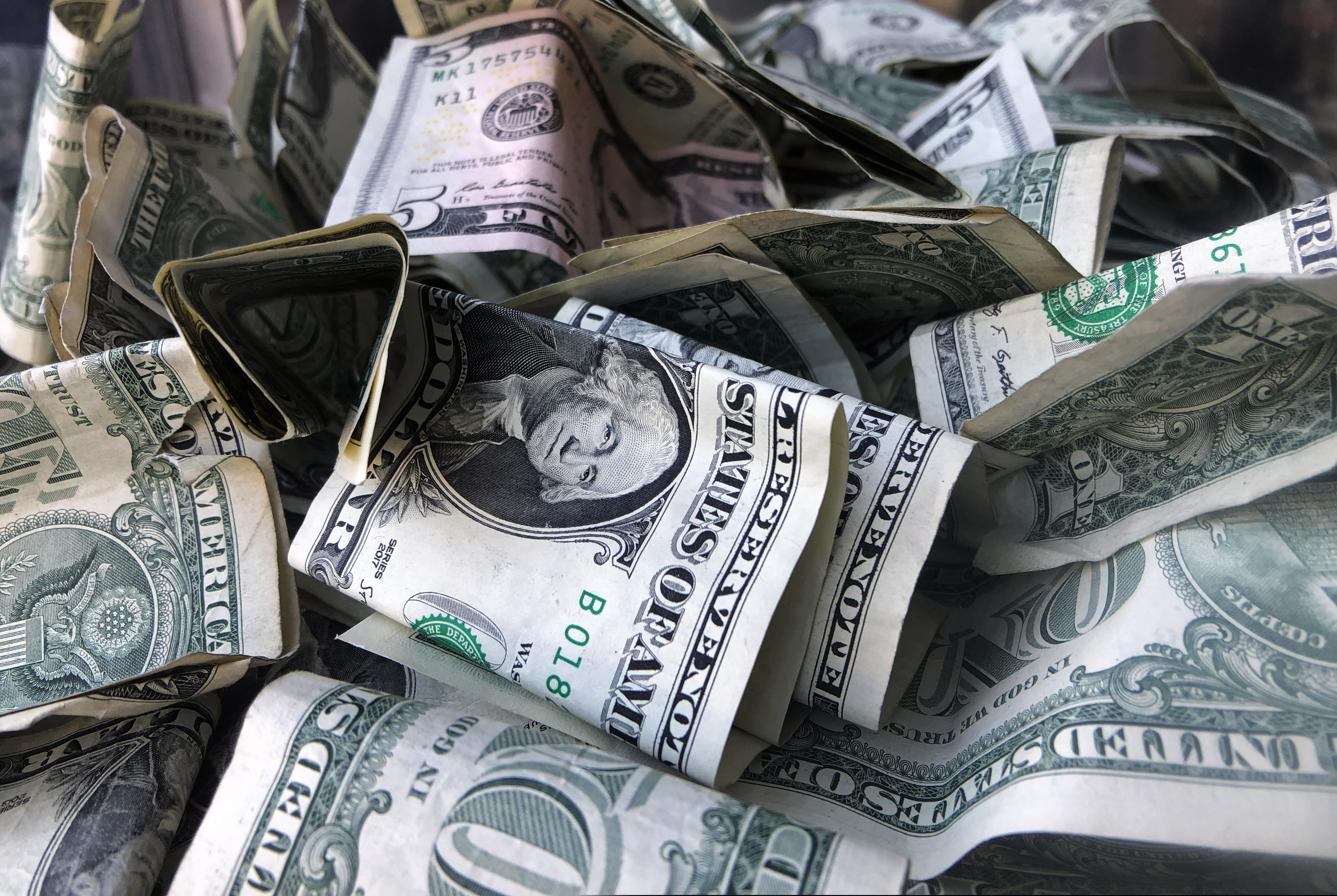 (Mark Lennihan | AP photo)

This April 3, 2019, photo shows a tip box filled with U.S. currency in New York.