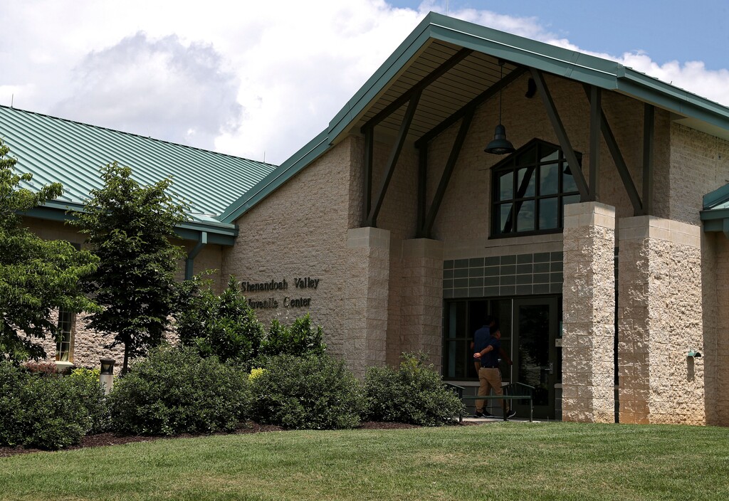 FILE - In this June 20, 2018 file photo, the Shenandoah Valley Juvenile Center is shown in Staunton, Va.  Virginia investigators say they’ve found no evidence of abuse at a detention facility after immigrant teens described being strapped to chairs with their heads covered with bags. The investigation found the Shenandoah Valley Juvenile Center does use restraint chairs on “out-of-control” residents considered a safety threat, but that doesn’t meet the legal threshold of abuse or neglect.  (AP Photo/Zachary Wajsgras)