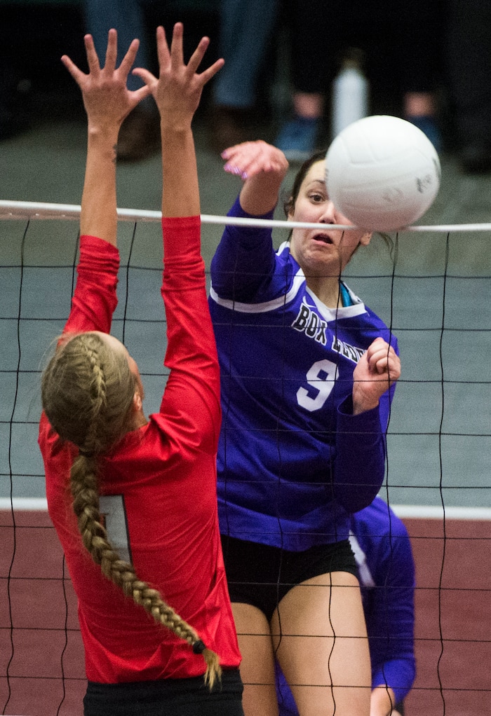 (Rick Egan  |  The Salt Lake Tribune)  Box Elder Bees Jaida Burt (9) hits the ball past Bountiful Braves Baylee Mittelstaedt (1), in 5A volleyball championship game, Bountiful vs. Box Elder, at Utah Valley University, Saturday, November 4, 2017.