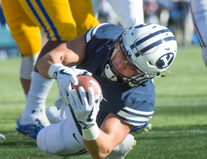 (Rick Egan  |  The Salt Lake Tribune)    Brigham Young Cougars running back Lopini Katoa (4) scores his first of two second quarter touchdowns, in football action Brigham Young Cougars vs McNeese State Cowboys at Lavell Edwards Stadium, Saturday, Sept. 22, 2018.


