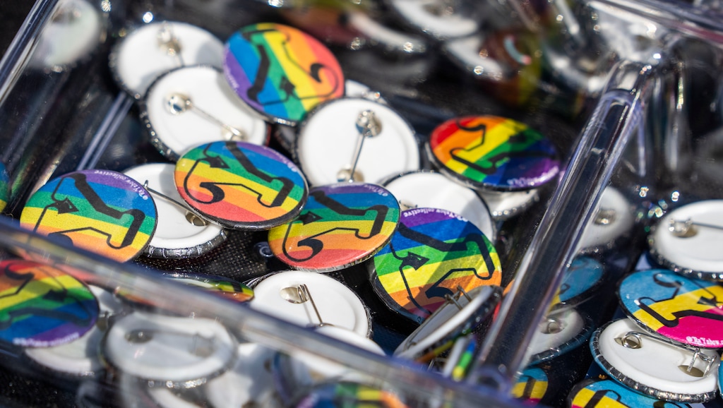(Rick Egan | The Salt Lake Tribune) Rainbow "Y" pins at a booth at Kiwanis Park, during Pride Night in Provo organized by BYU students, on Saturday, Sept. 4, 2021. There's a new social media movement to support LGBTQ students at the private Utah school owned by The Church of Jesus Christ of Latter-day Saints in June 2022.