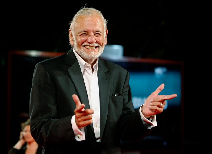 FILE - In this Sept. 9, 2009, file photo, director George Romero arrives for the screening of the film "Survival Of The Dead" at the 66th edition of the Venice Film Festival in Venice, Italy. Romero, whose classic "Night of the Living Dead" and other horror films turned zombie movies into social commentaries and who saw his flesh-devouring undead spawn countless imitators, remakes and homages, has died. He was 77. Romero died Sunday, July 16, 2017, following a battle with lung cancer, said his family in a statement provided by his manager Chris Roe. (AP Photo/Andrew Medichini, File)