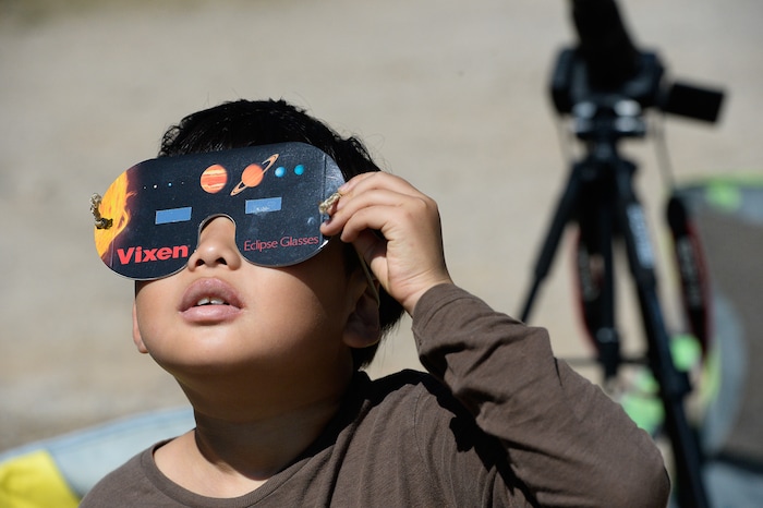 (Francisco Kjolseth  |  The Salt Lake Tribune)  Jun Hwee Shim, 10, of South Korea takes in the total eclipse of the sun from Palisades Reservoir, Idaho, on Monday, August 21, 2017.