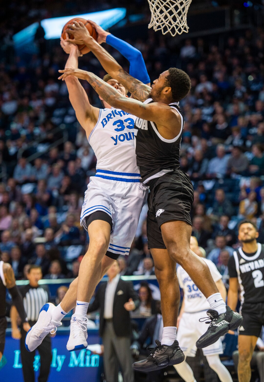 (Rick Egan  |  The Salt Lake Tribune)       Nevada Wolf Pack guard Nisre Zouzoua (5) stops a layup by Brigham Young Cougars forward Dalton Nixon (33), in basketball action between the Brigham Young Cougars and the Nevada Wolf Pack, at the Marriott Center, in Provo, Saturday, December 10, 2019.