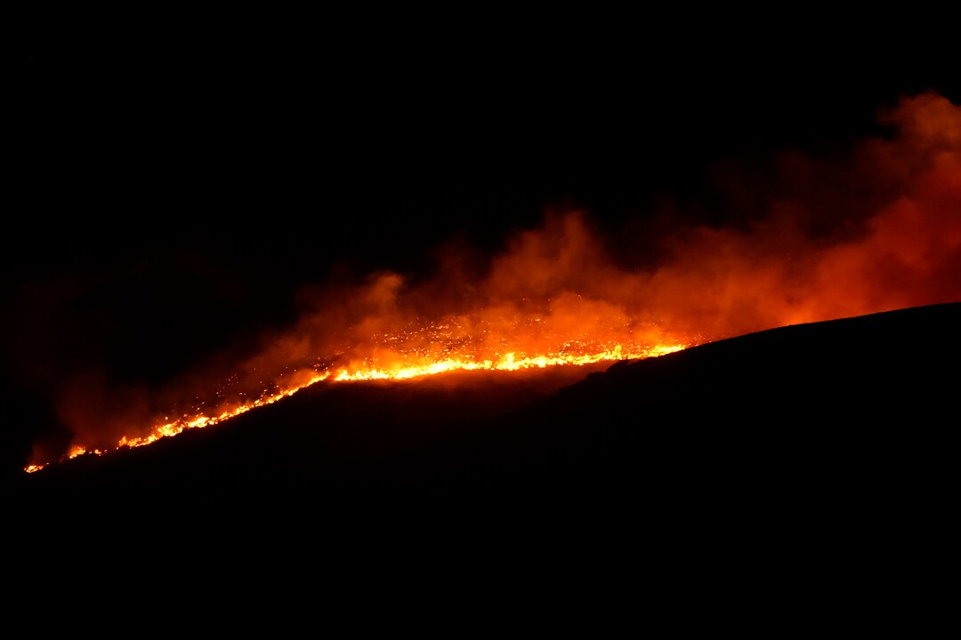 (George Frey  |  for The Salt Lake Tribune) A wildfire burns on Traverse Mountain above Lehi, Uta,h on June 28th, 2020.