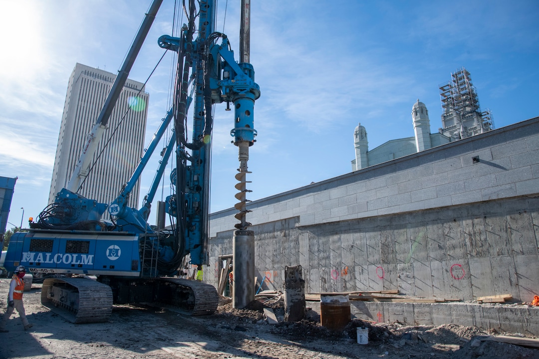 (Photo courtesy The Church of Jesus Christ of Latter-day Saints) In this June 2020 photo, an auger is drilling a hole with the help of segment casings. The 15-foot segment casings help create a hole up to 60 feet deep. A steel piling will be dropped into the hole and filled with concrete. The steel piles are part of a retaining wall that will line the temple property and will also be installed around the temple in preparation for excavating a 40-feet-deep hole as part of the seismic upgrade.