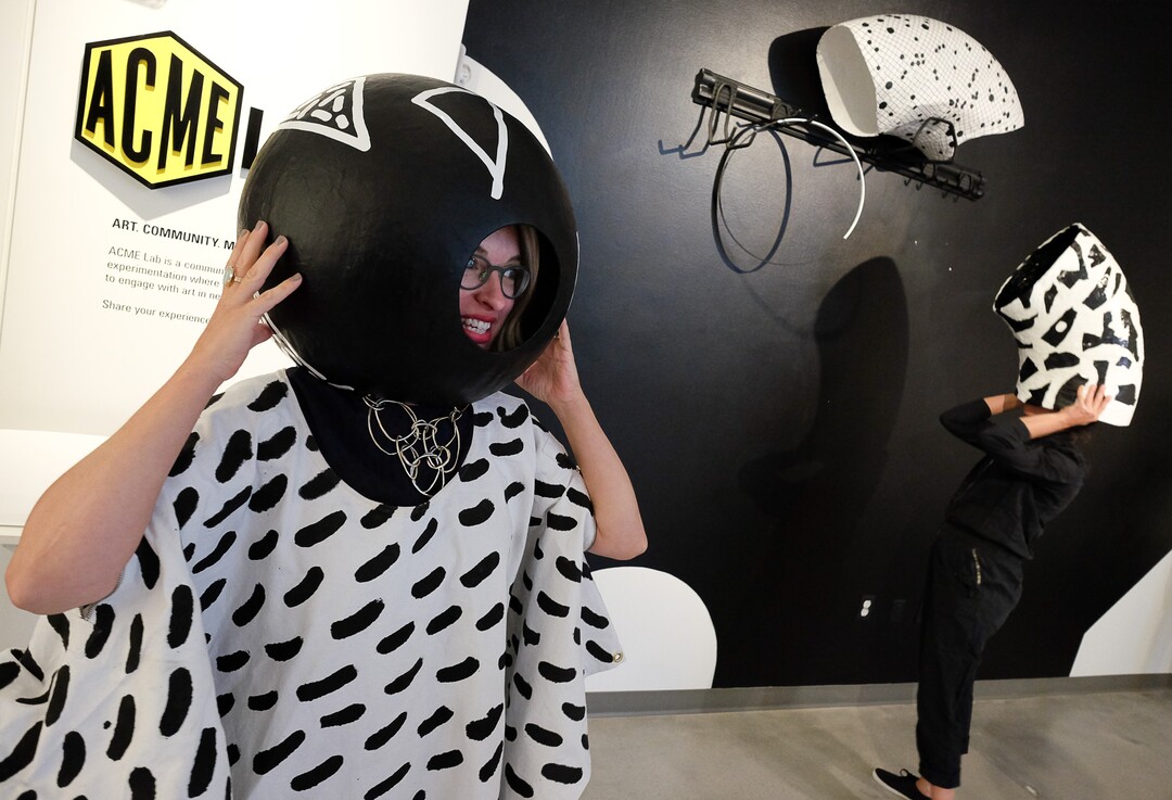 (Francisco Kjolseth  |  The Salt Lake Tribune)  Gretchen Dietrich, executive director of the Utah Museum of Fine Arts, geeks out with interactive art in the museum's new ACME Lab. The community space is designed for creative experimentation where visitors are encouraged to engage with art in fun new ways. UMFA reopens to the public on Saturday, Aug. 26, for a two-day celebration featuring new exhibits, tours, talks, art making, yoga, a dance party and more with free admission.