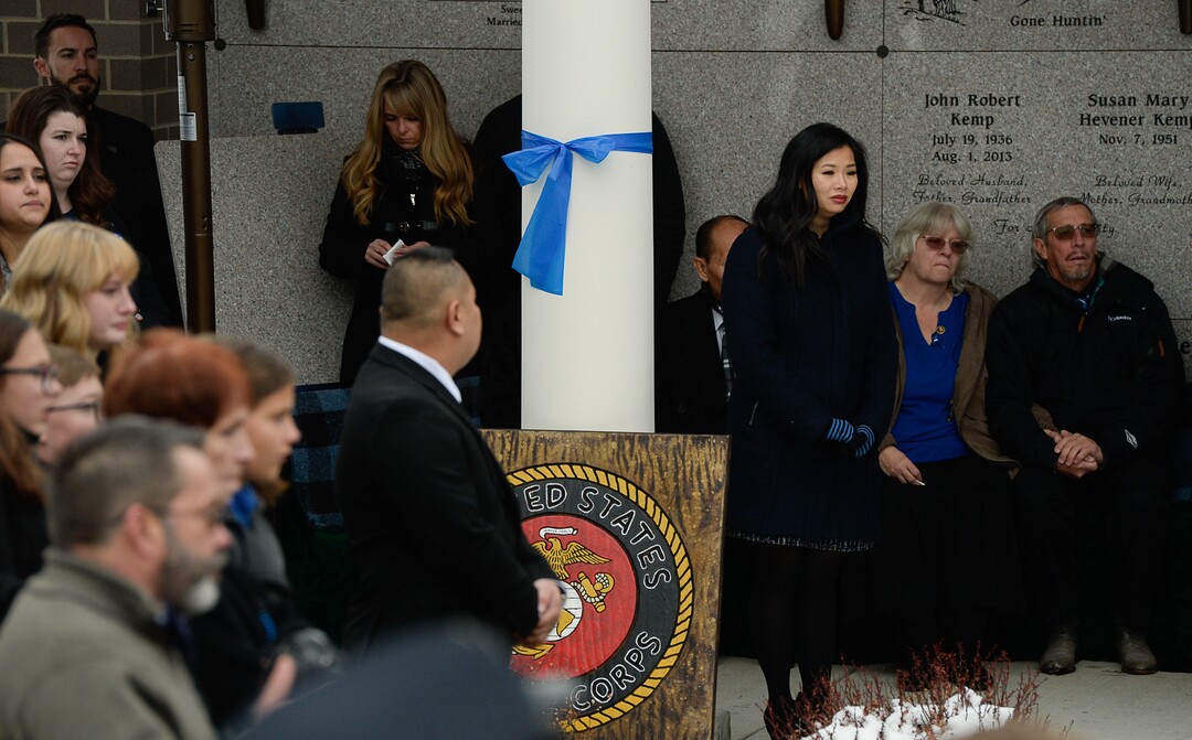 (Francisco Kjolseth  |  The Salt Lake Tribune)  Elizabeth Romrell watches as the flag draping the casket of her husband, police officer David Romrell is folded by the Marine Corps during funeral services at Larkin Sunset Gardens Cemetery in Sandy, Wed. Dec. 5, 2018.