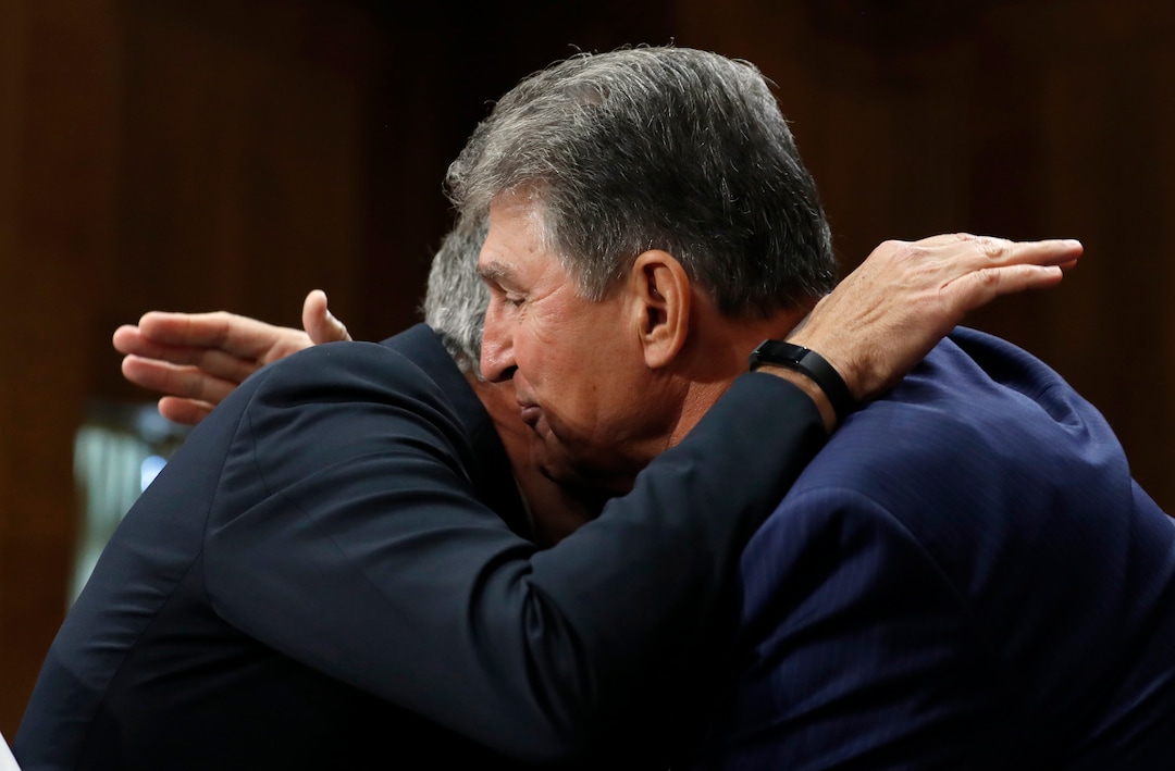 (AP Photo/Alex Brandon) Former Utah Gov. Jon Huntsman, left, embraces Sen. Joe Manchin, D-W.Va., after Manchin introduced Hunstman during a hearing of the Senate Foreign Relations Committee on his nomination to become the U.S. ambassador to Russia, on Capitol Hill, Tuesday, Sept. 19, 2017 in Washington.