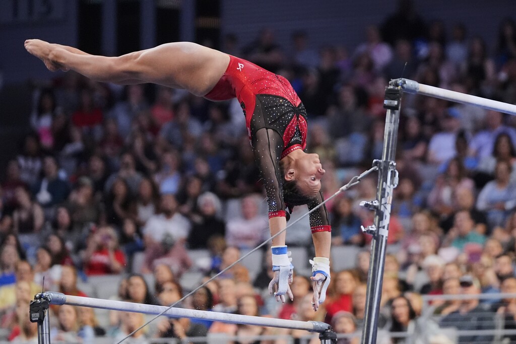 Utah's Grace McCallum competes on the uneven bars during the NCAA women's gymnastics championships in Fort Worth, Texas, Saturday, April 19, 2025. (AP Photo/Tony Gutierrez)