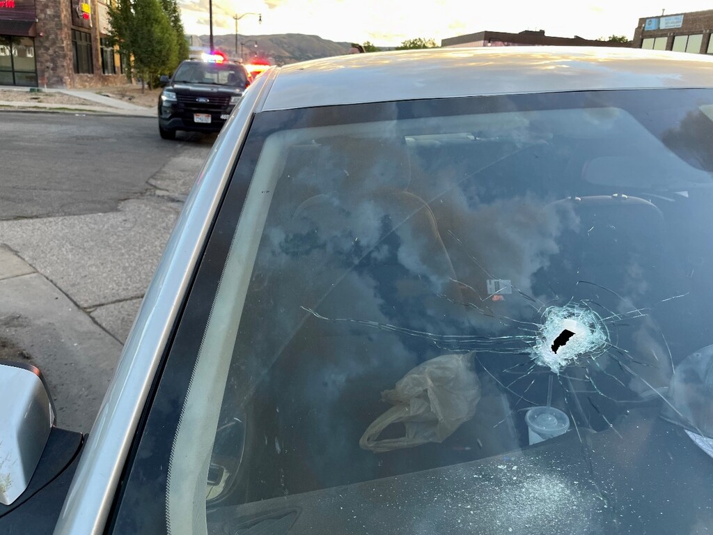 (Salt Lake City Police Department) The hole in the windshield of a car is believed to have been from a bullet fired during an altercation near Major Street in Salt Lake City that sent one man to the hospital in critical condition Sunday, July 3, 2022.