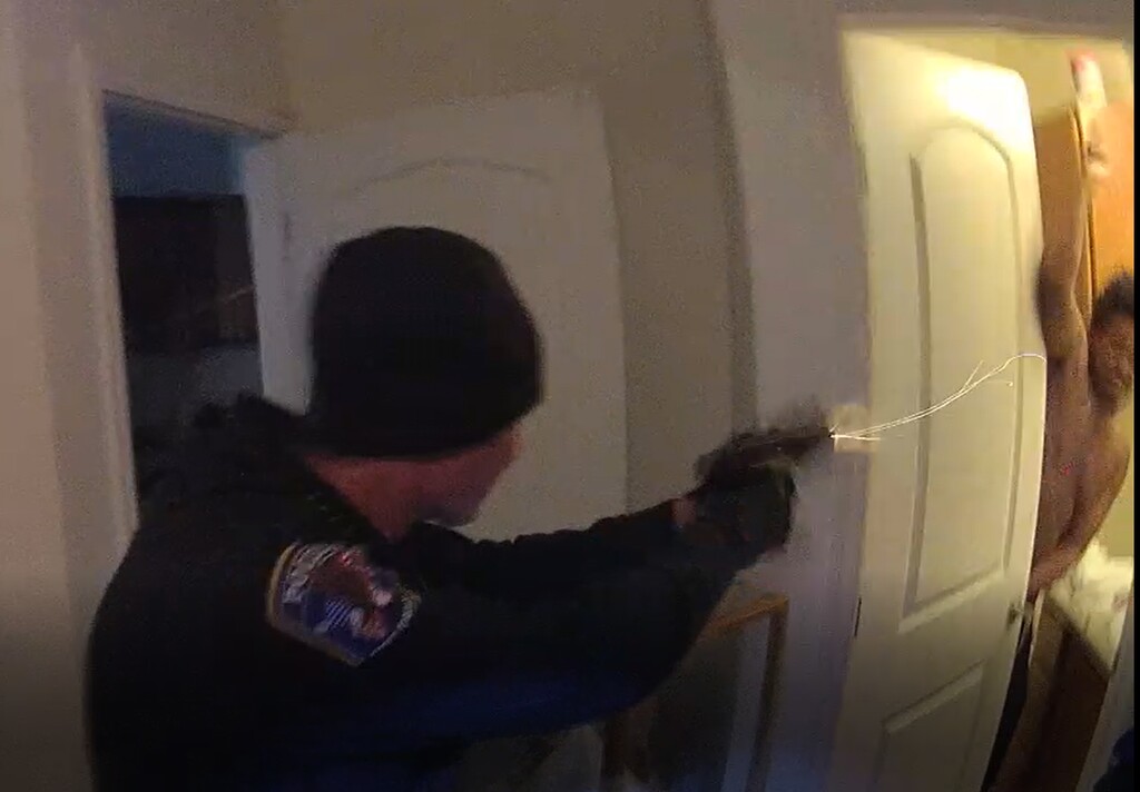 (Photo courtesy of the Salt Lake County District Attorney's Office.) West Jordan police officer Brian White fires a taser at Diamonte Riviore as Riviore raises a knife over his head. Riviore was shot twice in the torso and died Oct. 11, 2018. Salt Lake County Attorney Sim Gill ruled that the shooting was justified.
