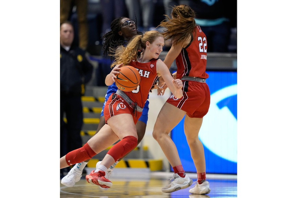 (Francisco Kjolseth | The Salt Lake Tribune) Utah Utes guard Gianna Kneepkens (5) moves the ball in basketball action between the Utah Utes and the Brigham Young Cougars, at the Marriott Center in Provo, on Saturday, Dec. 10, 2022.