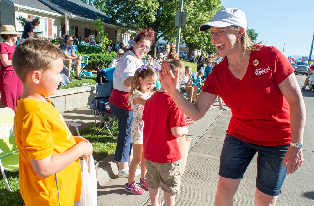 (Rick Egan  |  The Salt Lake Tribune)    Rep. Melissa Ballard high-fives the crowd as she walks in the Bountiful Handcart Days Parade, Friday, July 19, 2019.