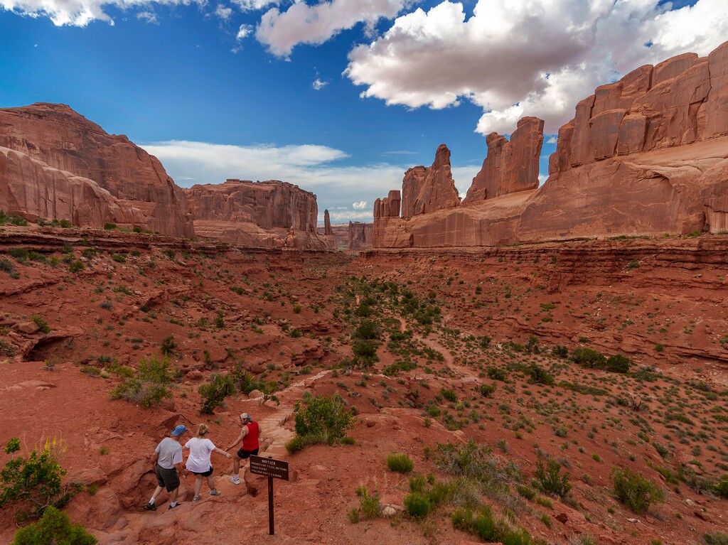 (Leah Hogsten | The Salt Lake Tribune)  Visitors hike into Park Avenue in Arches National Park, Monday, May 15, 2023.