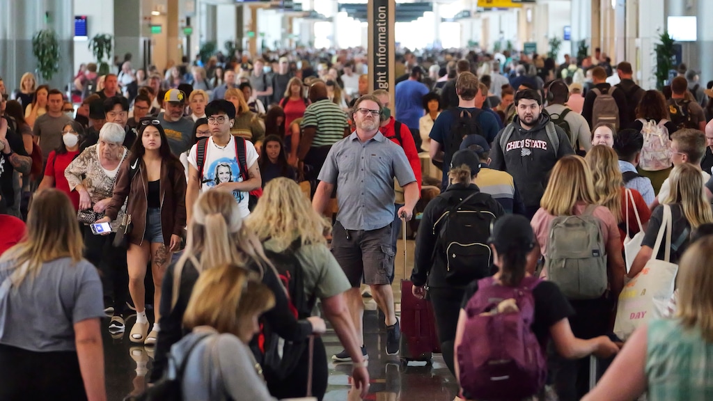 (Rick Bowmer | AP) Travelers pass through Salt Lake City International Airport, Thursday, June 2, 2022, in Salt Lake City.