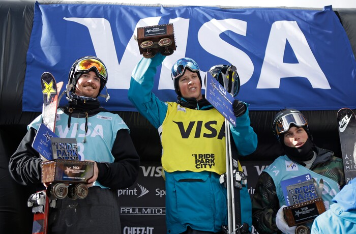 First-place finisher Joss Christensen, center, is flanked by second-place Mcrae Williams, left, and third-place Gus Kenworthy on the podium after the World Cup freestyle skiing event Friday, Feb. 27, 2015, in Park City, Utah. (AP Photo/Rick Bowmer) 
