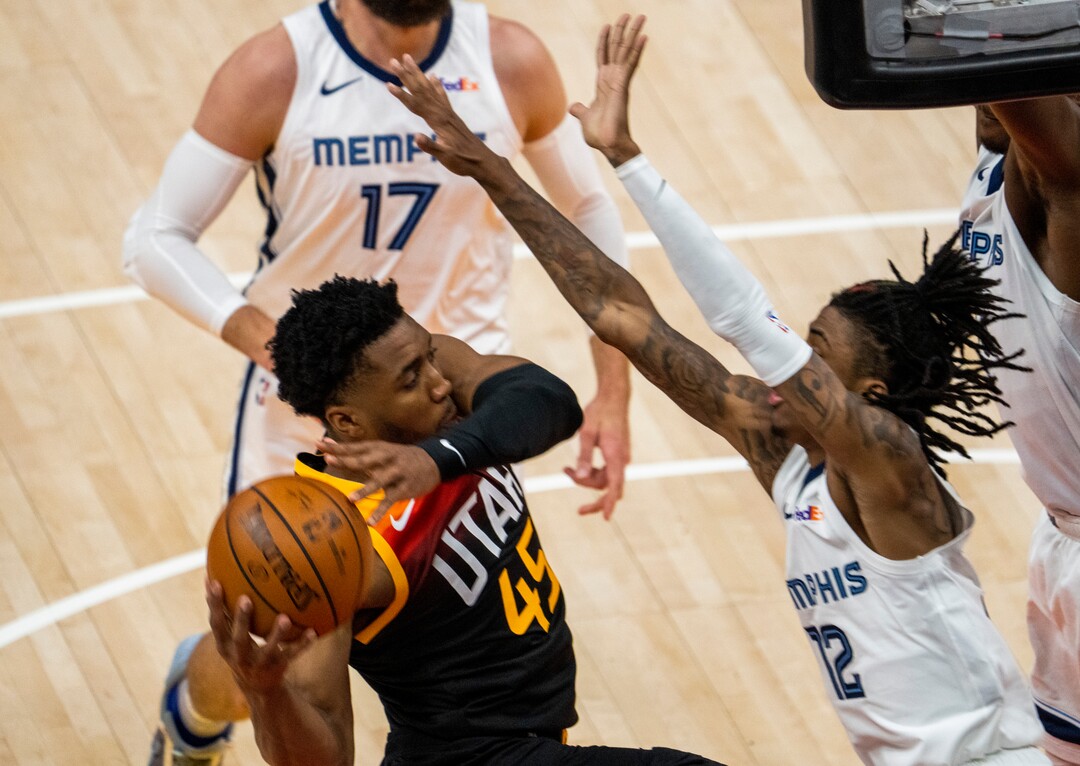 (Rick Egan | The Salt Lake Tribune)Utah Jazz guard Donovan Mitchell (45) takes the ball inside, as Memphis Grizzlies guard Ja Morant (12) defends, in NBA Playoff game 2, between the Utah Jazz and the Memphis Grizzlies at Vivint Arena, on Wednesday, May 26, 2021.