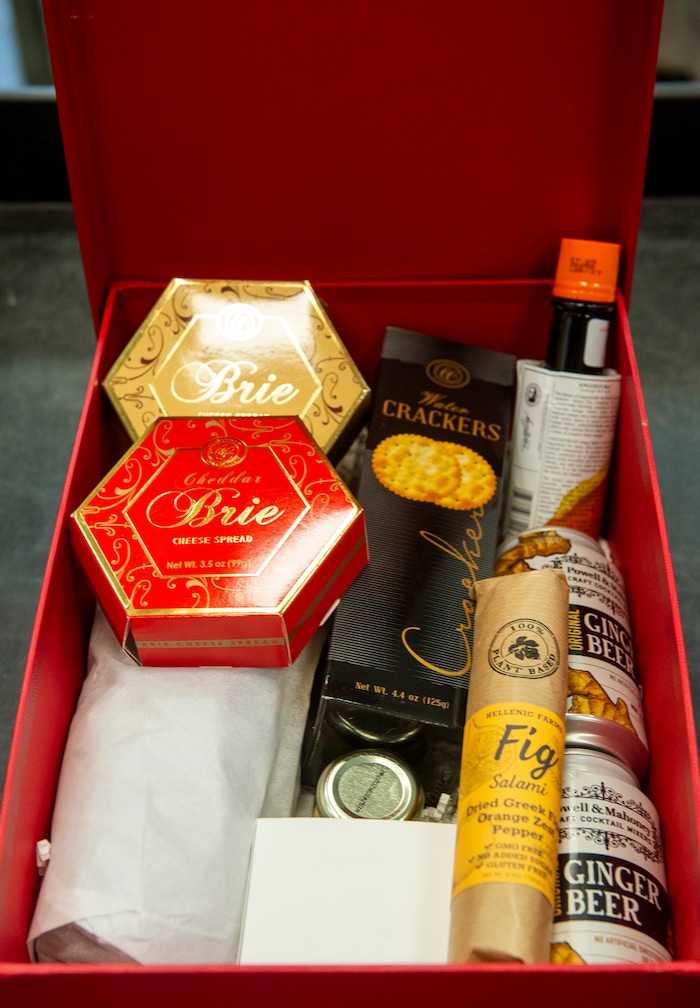 (Rick Egan | The Salt Lake Tribune)  Maxine Turner, founder of Cuisine Unlimited, and her staff are preparing Boxes for a Christmas party, Wednesday, Nov. 25, 2020.