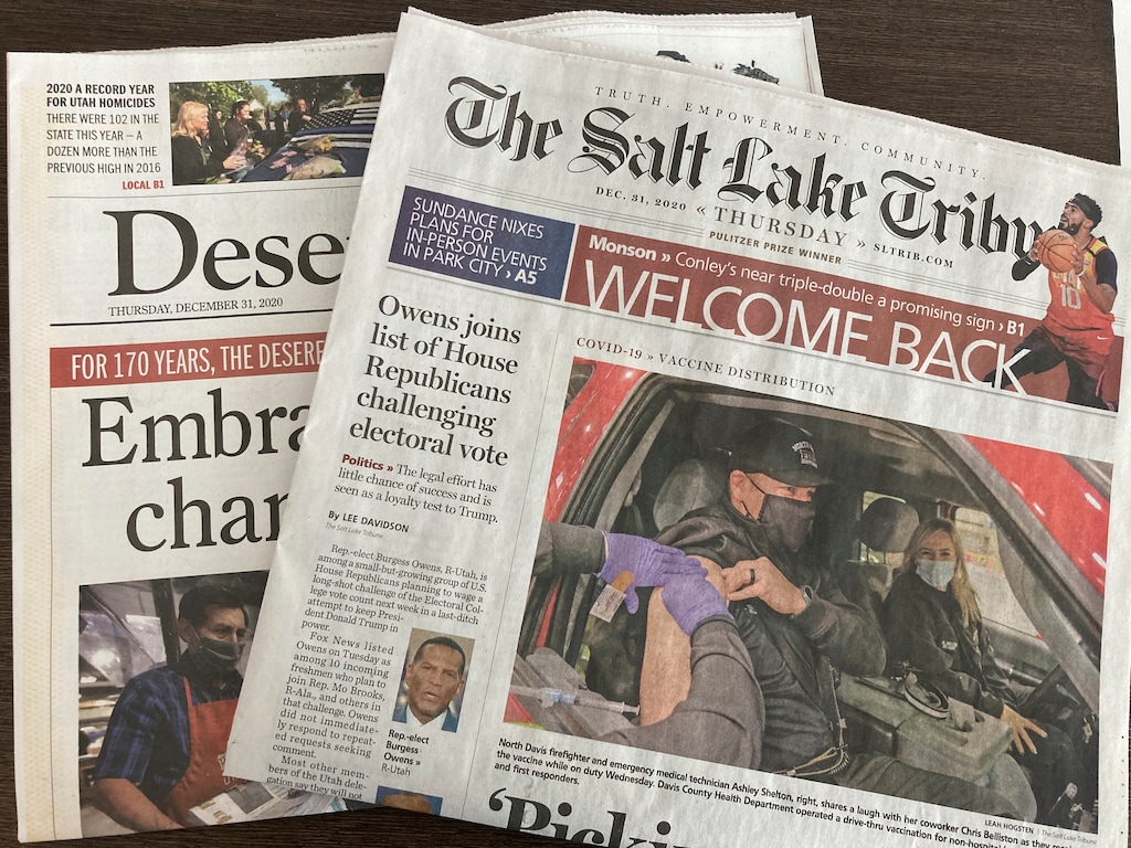 The final print editions of The Salt Lake Tribune and the Deseret News are seen on Thursday, Dec. 31, 2020. Salt Lake City's two major newspapers printed their final daily editions Thursday as they shift their attention online and transition to weekly print editions. It marks the end of an era of journalism that lasted more than a century in Utah. (AP Photo/Sophia Eppolito)