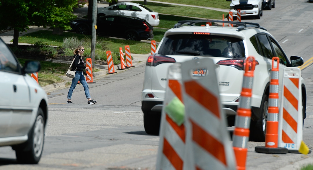 (Francisco Kjolseth  |  The Salt Lake Tribune)  Traffic moves along a sea of orange as plans to repurpose 29 parking spaces between 950 East and 1300 East on 900 South in Salt Lake City causes some frustration from business owners and residents in the area.