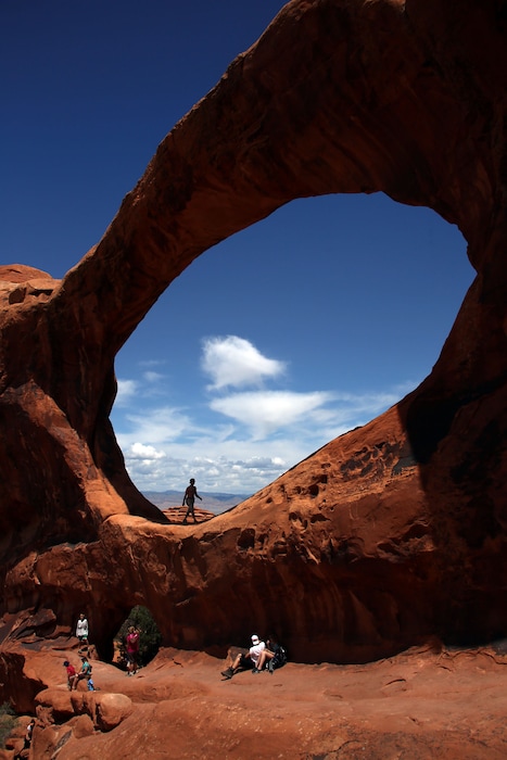 (Francisco Kjolseth  |  Tribune file photo) Visitors to Arches National Park come from around the world to visit its one of a kind features, including Double O Arch.