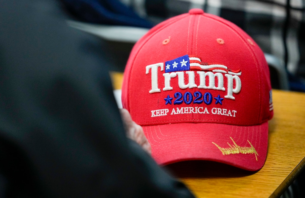 (Bethany Baker | The Salt Lake Tribune) A President Donald J. Trump baseball hat sits on a desk during the presidential primary caucuses at Riverton High School in Riverton on Tuesday, March 5, 2024. Does low turnout at Utah's GOP caucus mean trouble for Trump's 2024 election bid?