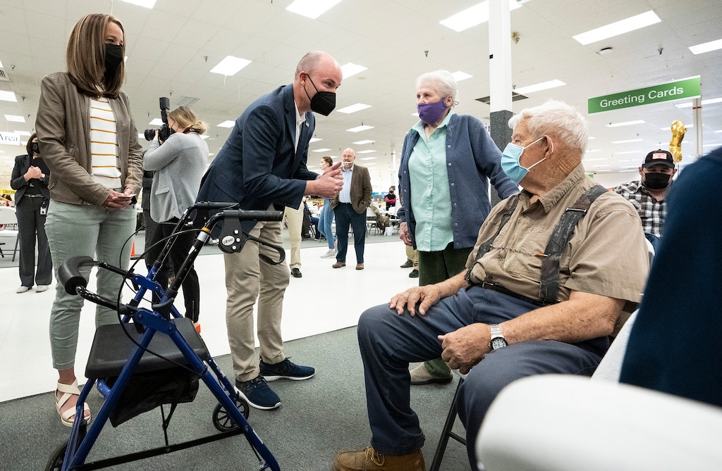 (Leah Hogsten | The Salt Lake Tribune) First lady Abby Cox and Gov. Spencer Cox greet Marion Dickey, 83, and Aaron Dickey, 91, as all four received their COVID-19 vaccine from Utah County Health Department in Spanish Fork, March 25, 2021. Cox, who received his vaccine live on camera Thursday, said there's been "great demand" for the COVID-19 vaccine throughout Utah, and credited vaccinations for the declining coronavirus case counts.