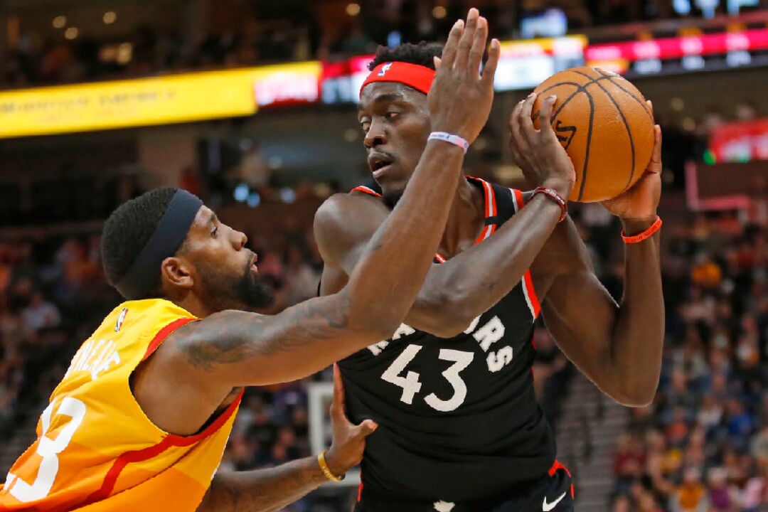 Utah Jazz forward Royce O'Neale, left, guards against Toronto Raptors forward Pascal Siakam (43) in the first half during an NBA basketball game Monday, March 9, 2020, in Salt Lake City. (AP Photo/Rick Bowmer)