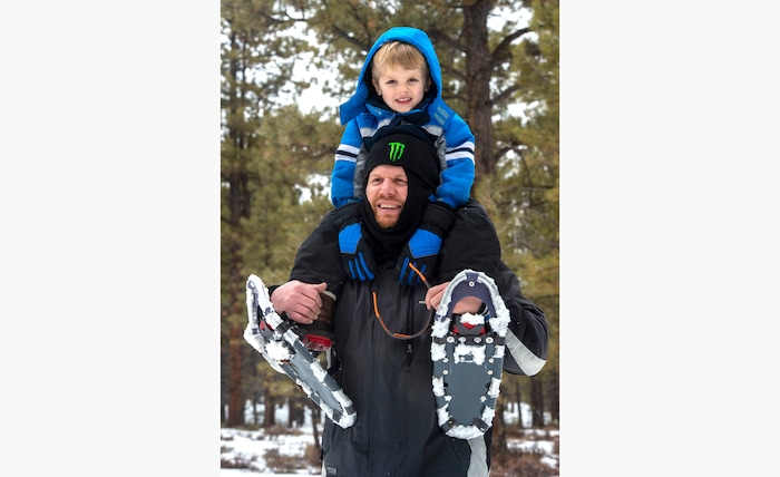 (Rick Egan | The Salt Lake Tribune) Collin Holmberg from West jordan, gives Hayden, 4, a ride on his shoulders, during 
a snowshoe tour of the Dixie National Forest during the 36th annual Bryce Canyon Winter Festival on Saturday, Feb. 13, 2021.
