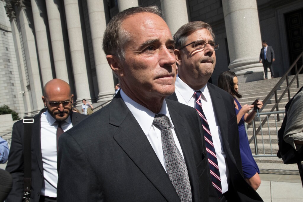 Republican U.S. Rep. Christopher Collins, center, leaves federal court, Wednesday, Aug. 8, 2018, in New York. Rep. Collins of western New York state has been indicted on charges that he used inside information about a biotechnology company to make illicit stock trades (AP Photo/Mary Altaffer)