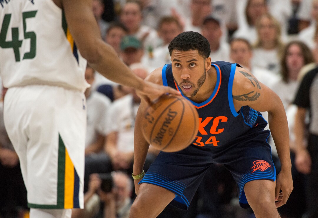 (Rick Egan  |  The Salt Lake Tribune)    Oklahoma City Thunder guard Josh Huestis (34) eyes Utah Jazz guard Donovan Mitchell (45), in game 4, NBA playoff action between Utah Jazz and Oklahoma City Thunder, in Salt Lake City, Monday April 23, 2018.