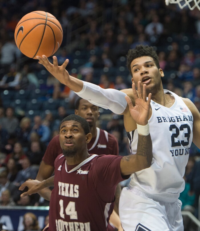 (Rick Egan  |  The Salt Lake Tribune)   Brigham Young Cougars forward Yoeli Childs (23) grabs a rebound over Texas Southern Tigers forward Lamont Walker (14), in basketball action, Brigham Young Cougars vs Texas Southern Tigers, at the Marriott Center in Provo, Saturday, December 23, 2017.