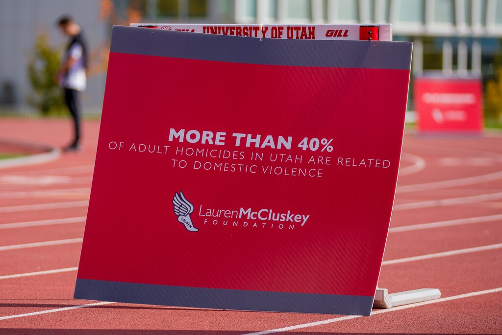 (Trent Nelson | The Salt Lake Tribune) On the three-year anniversary of Lauren McCluskey's murder, a memorial walk takes place with signs about dating violence and stalking lining the track at the University of Utah in Salt Lake City on Friday, Oct. 22, 2021.