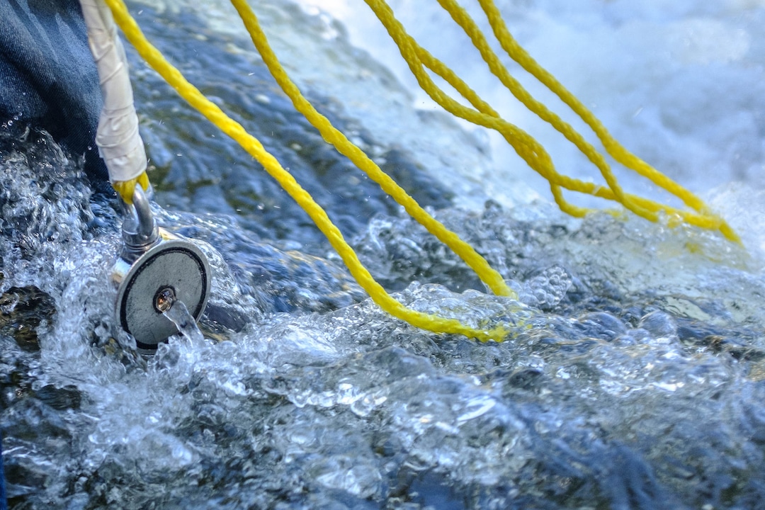 (Trent Nelson  |  The Salt Lake Tribune)  
Magnet fishing the Weber River on Saturday Aug. 31, 2019. Volunteers assisted the Utah Cold Case Coalition, hoping to find evidence in several cases.