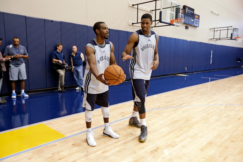 (Mark Humphrey | AP) Point guard Mike Conley, left, and forward Rudy Gay, right, vie for the ball during NBA basketball training camp on Tuesday, Oct. 2, 2012, in Memphis, Tenn.