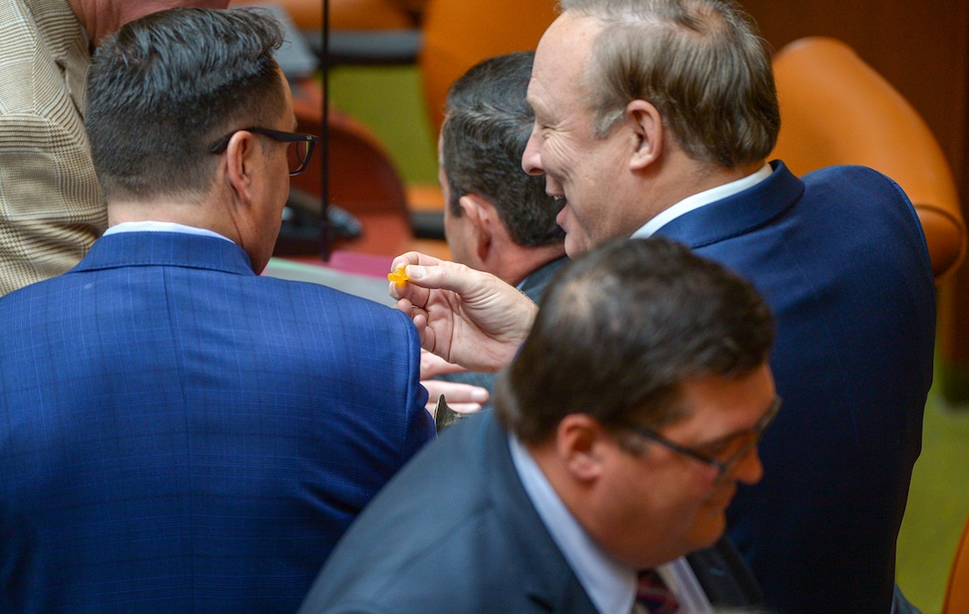 (Leah Hogsten  |  The Salt Lake Tribune)  Outgoing State Sen. Jim Dabakis offers House Speaker Greg Hughes a candy gummy bear. Debakis who jokingly offered Utah House members candy gummy bears that look similar to marijuana-infused edibles. Utah legislators voted to change the Utah Medical Cannabis Act, the bill that officials, Prop 2 opponents and medical marijuana advocates crafted and pitched as a compromise. On Monday, Dec. 2, 2018 during the special session, lawmakers overhauled the medical cannabis distribution system, reduces the number of medical marijuana outlets, prohibits edibles for gelatin cubes instead and changes the list of illnesses that qualify for cannabis treatments.