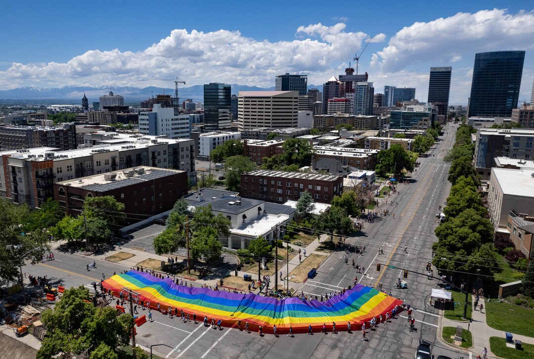 (Francisco Kjolseth | The Salt Lake Tribune) The large rainbow flag that takes up the rear of the Utah Pride Parade is carried in Salt Lake City on Sunday, June 4, 2023.