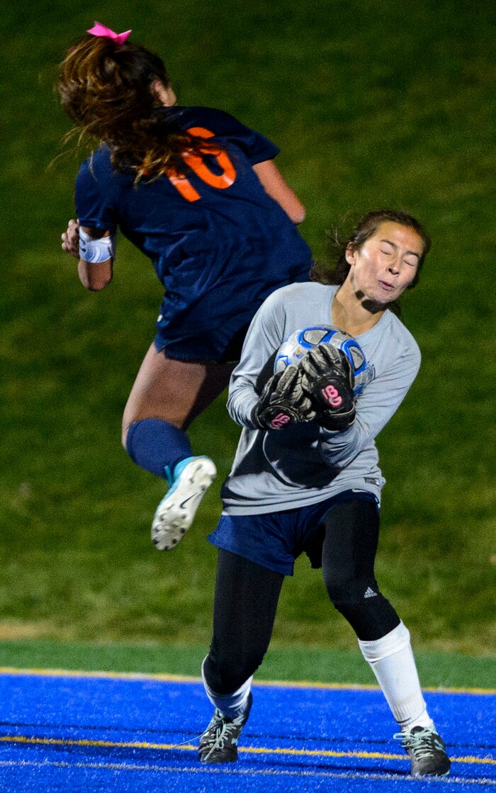 (Steve Griffin | The Salt Lake Tribune) Timpanogos goalkeeper Mia Barlow makes a stop as Timpview's Tiana Tolman sails past her during the 5A semifinal girl's soccer match at Juan Diego High School in Draper Tuesday October 17, 2017.
