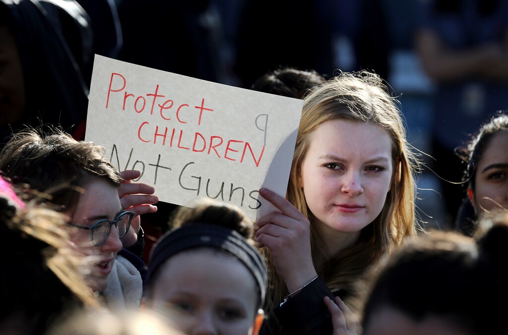 (AP file photo). Somerville High School junior Megan Barnes marches with others in Somerville, Mass., during a student walkout on Feb. 28, 2018. Students in Utah and around the country are planning a large-scale, coordinated demonstration for Wednesday, March 14, when organizers have called for a 17-minute school walkout nationwide to protest gun violence.  Students from upwards of 30 schools on Utah’s Wasatch Front are likely to participate.